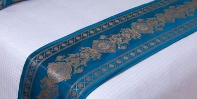 ​宾馆里床上的一块布有什么用,酒店床上的布条是干什么用的